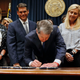 Georgia's Republican Gov. Brian Kemp, center, signs legislation in Atlanta, on May 7, 2019, banning abortions once a fetal heartbeat can be detected, which can be as early as six weeks before many women know they're pregnant. A federal appeals court on Wednesday, July 20, 2022, overturned a lower court ruling and said Georgia’s restrictive 2019 abortion law should be allowed to take effect.